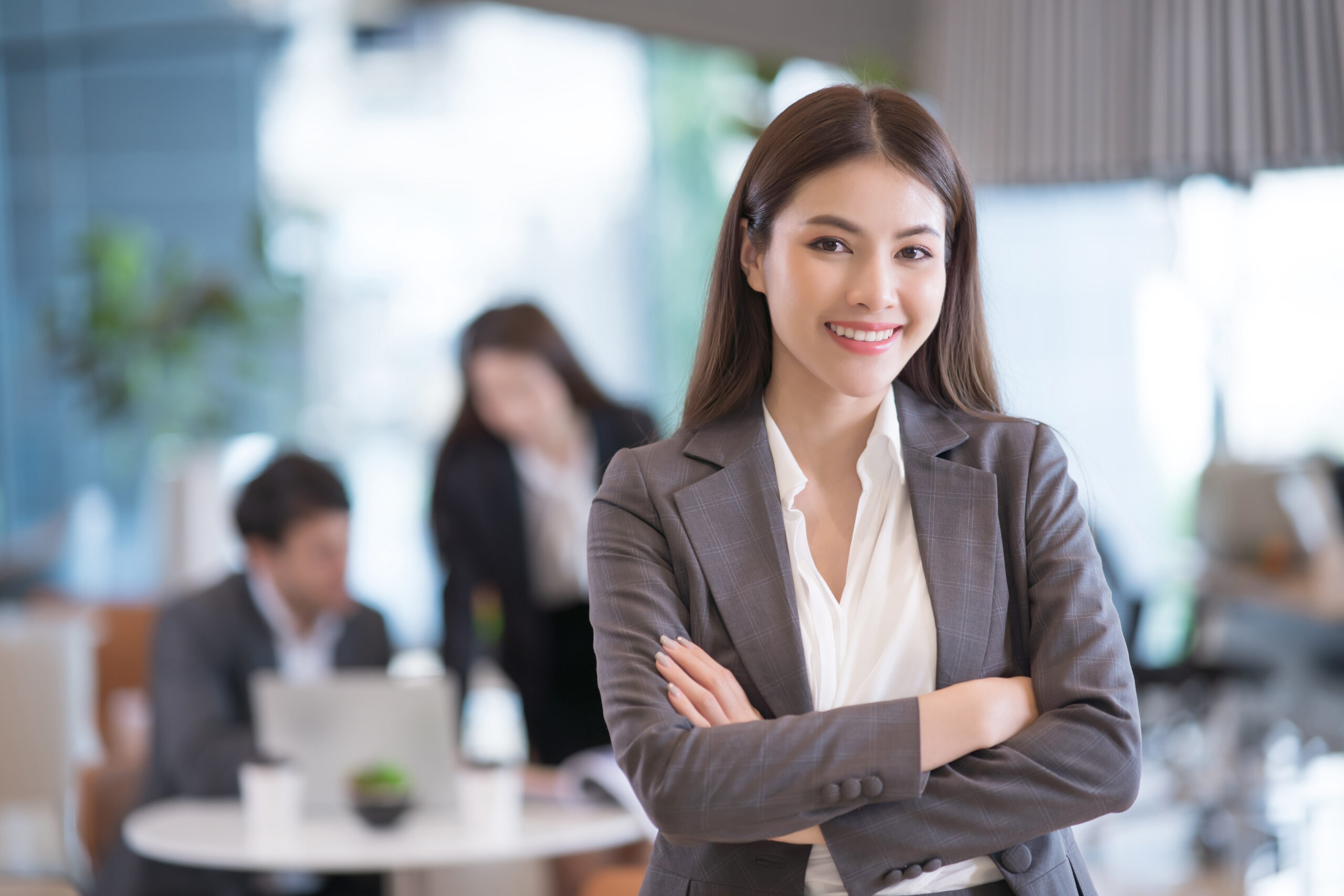 A sales and marketing professional crossing their arms